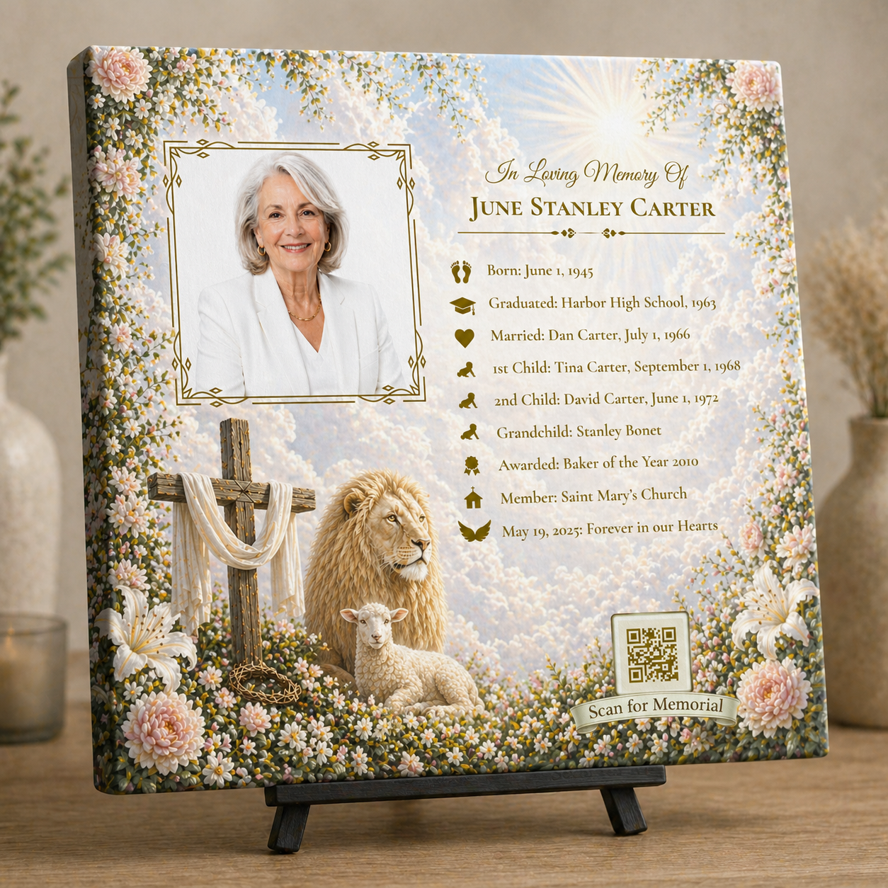 Memorial plaque with a portrait of a woman, cross, lion, and lamb design on a wooden surface.