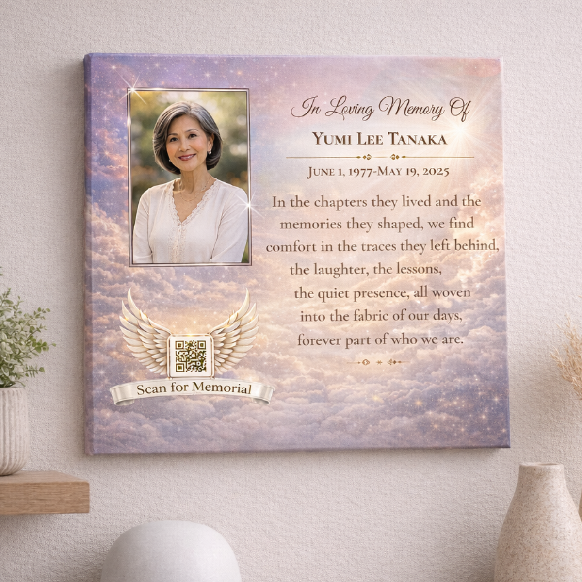 Memorial canvas featuring a woman's portrait, a quote, and a sky filled with clouds on a wall.