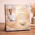 Memorial canvas with a portrait of a man and quote on a decorative stand.
