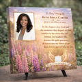 Memorial canvas featuring a woman's portrait, a quote, and a field of lupines on a decorative stand.